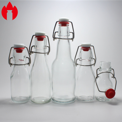 Vial de botella de vidrio moldeado transparente personalizado utilizado para soda, jugo, vino, cerveza y bebidas.